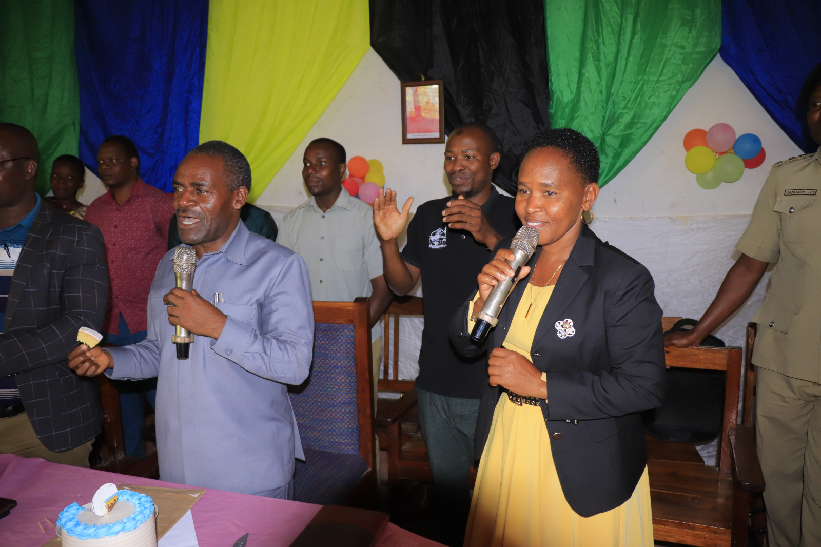 Photos of Mafanikio Foundation volunteers receiving certificates of honor from the Regional Education Officer of Tabora, Mr. Juma Japhet Kaponda, on behalf of the Regional Commissioner of Tabora, for successfully ensuring that all primary school graduates receive special training. Additionally, they launched the campaign "No Child Left Behind - Quality Education for All